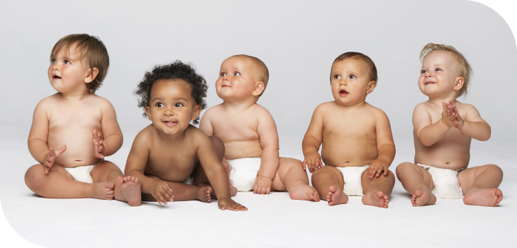 5 babies sitting and smiling