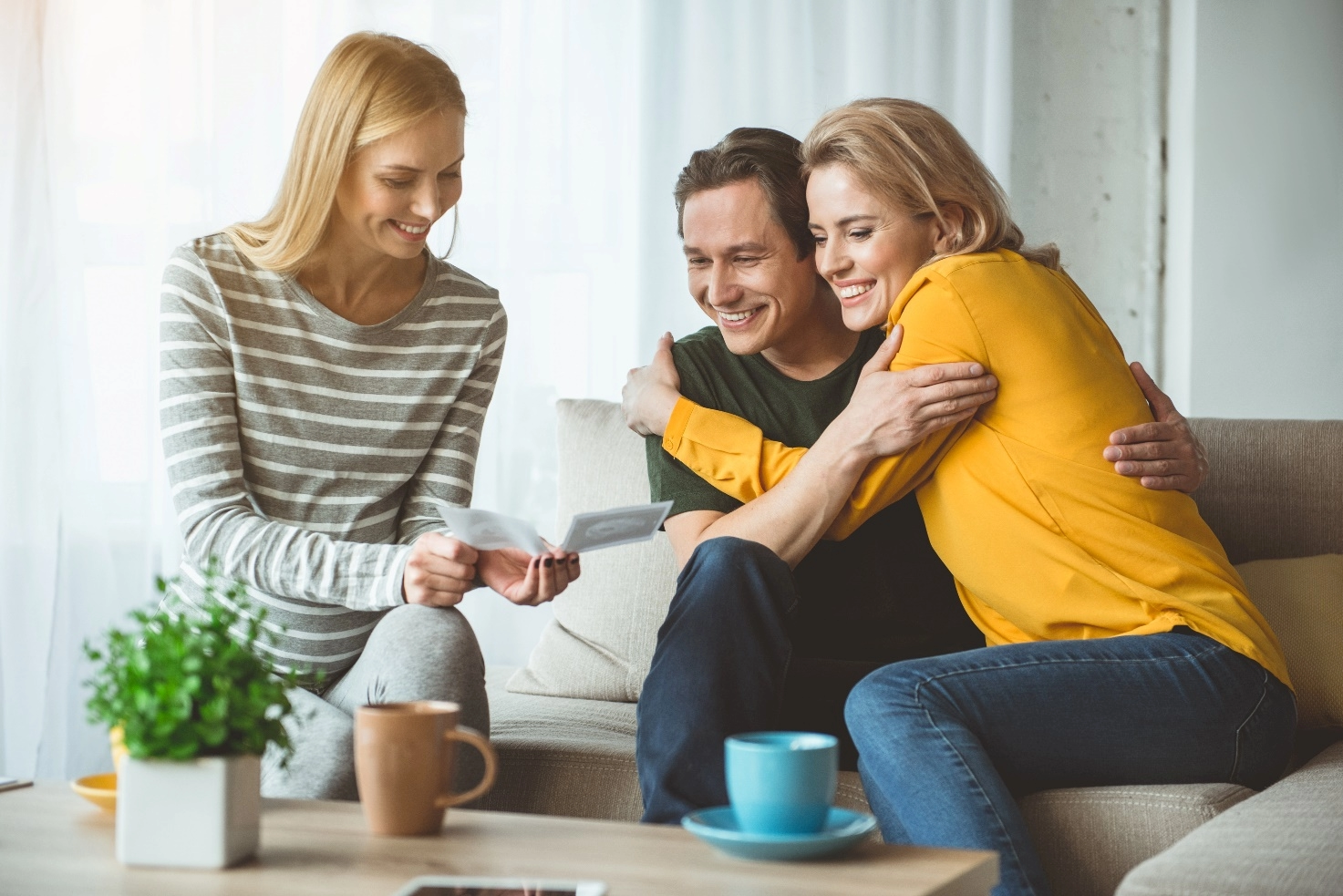 happy couple reading results with doctor